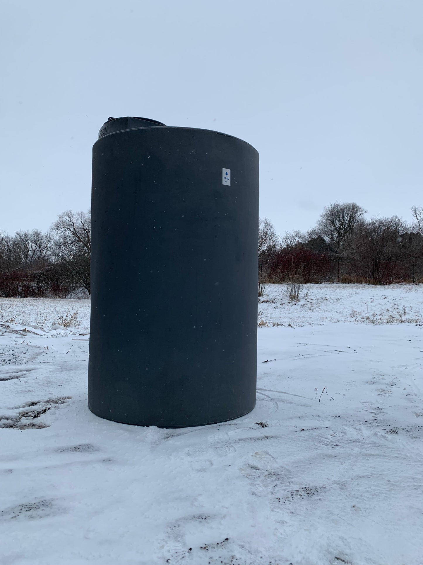 Dark Grey 500gal water tank in the snow