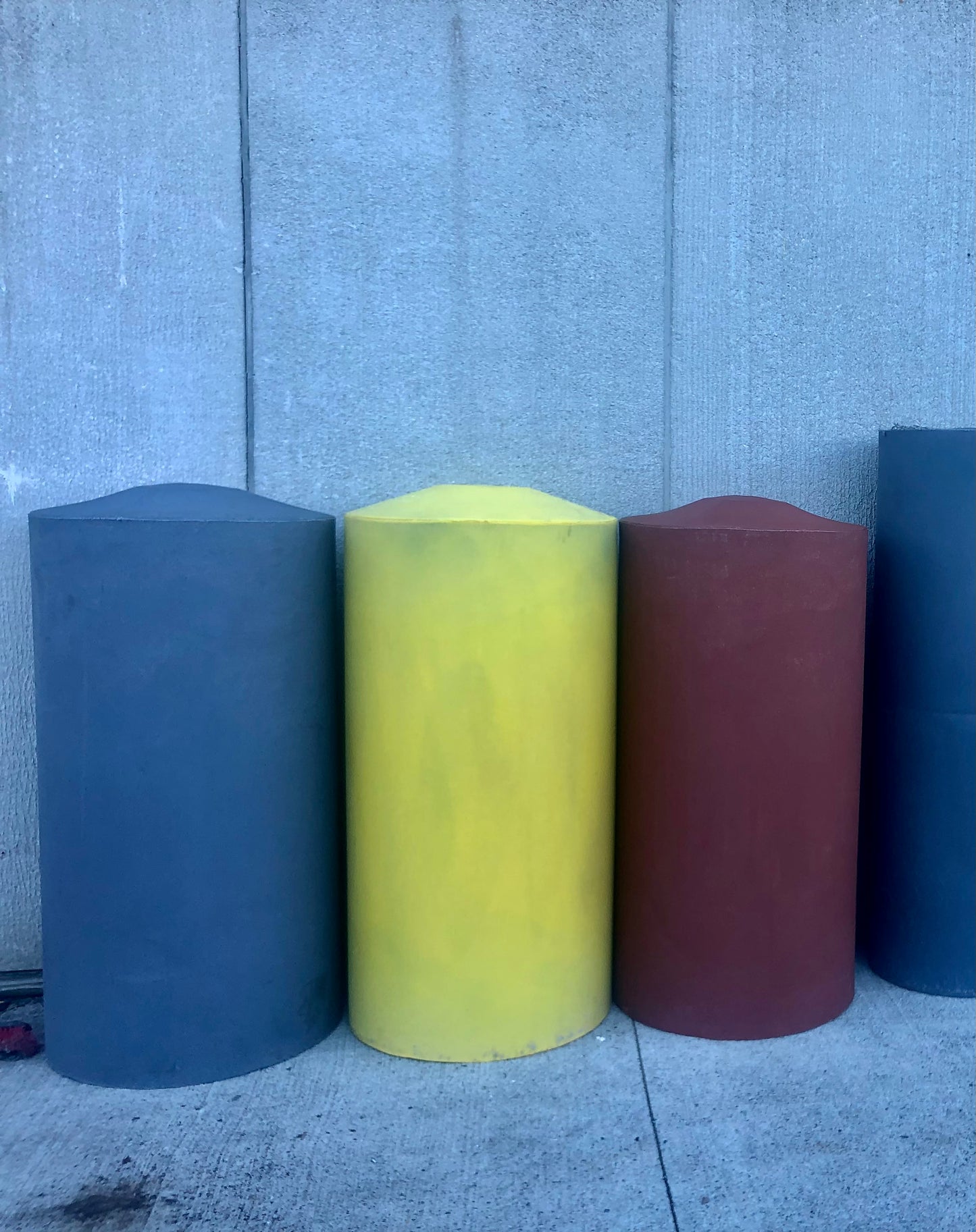 160 gal water tanks in grey, yellow and Brick red